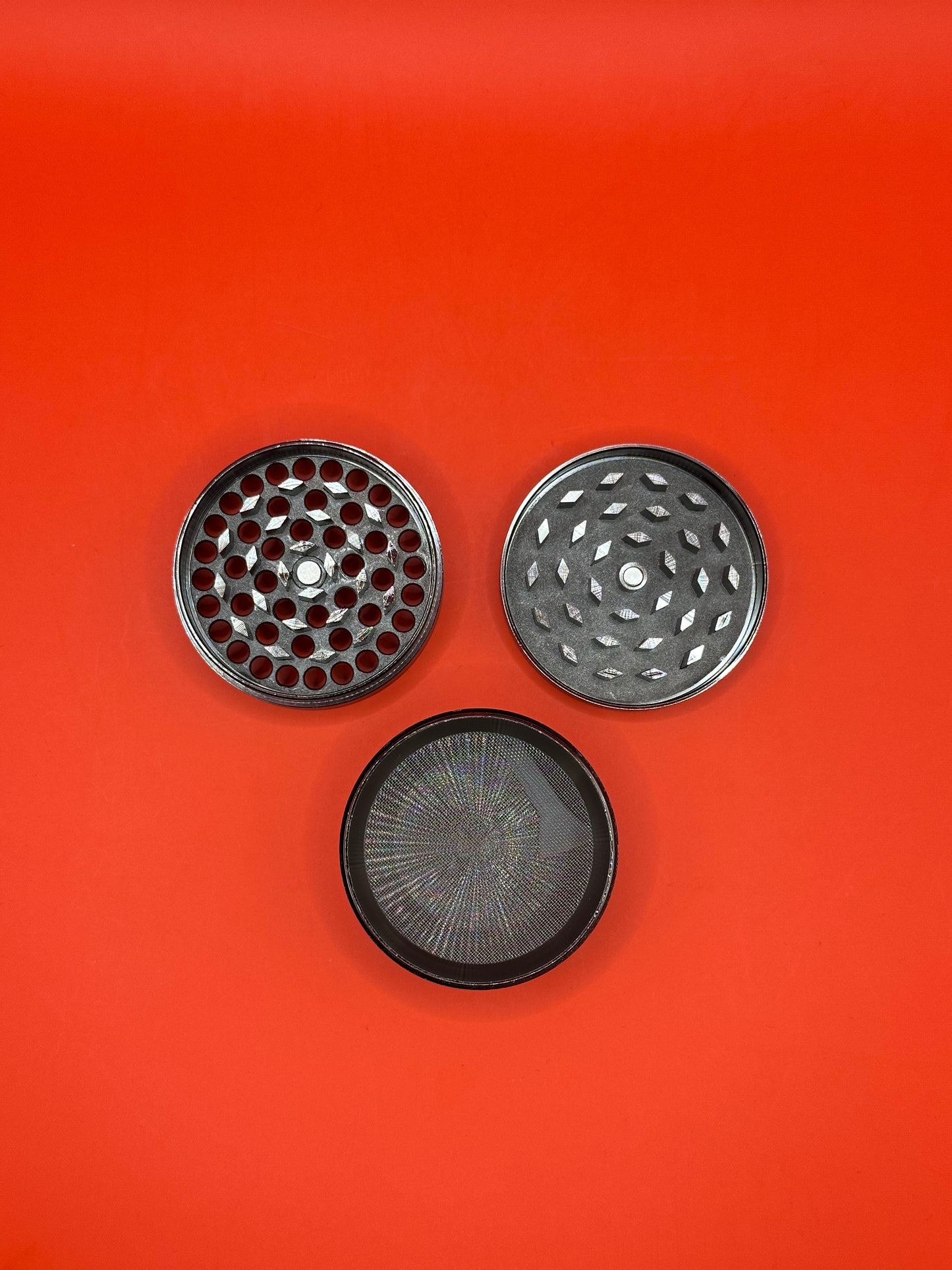 55mm shiny Metal Grinder with kief collector and scoop.