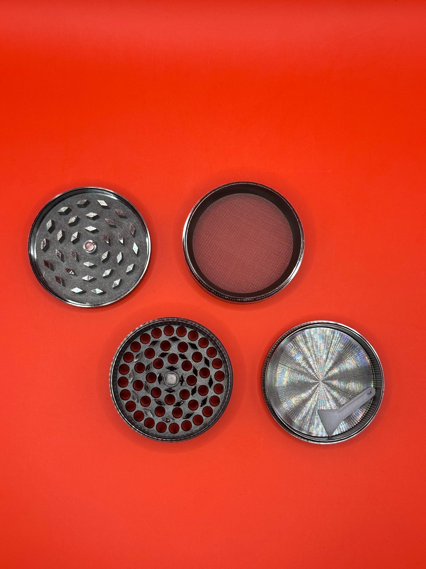 55mm shiny Metal Grinder with kief collector and scoop.