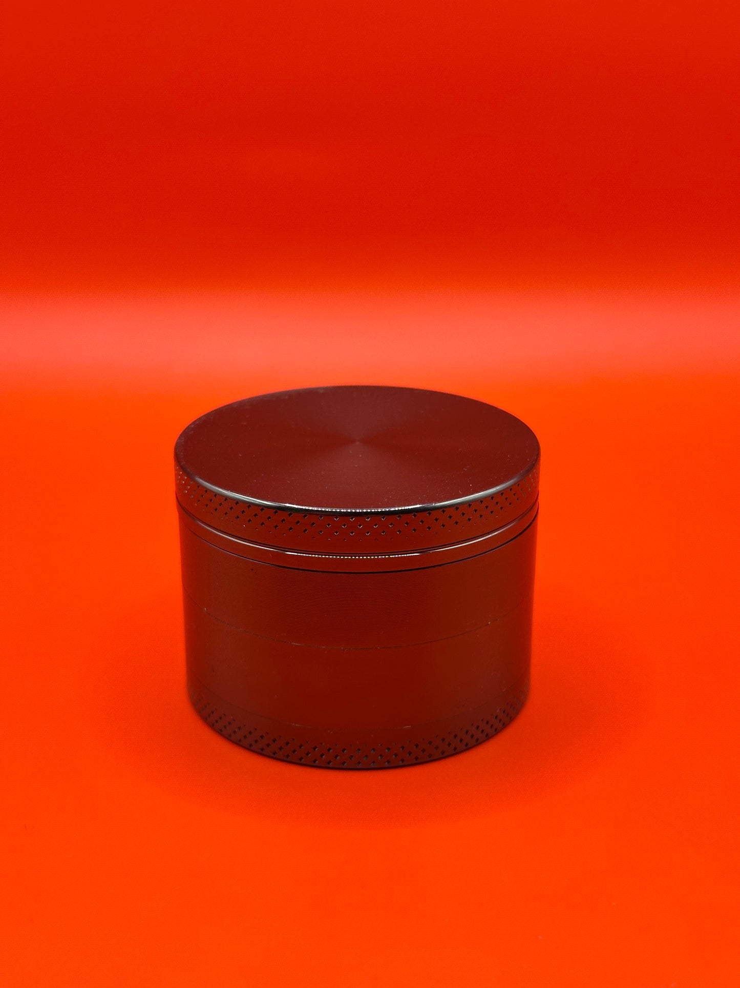 55mm shiny Metal Grinder with kief collector and scoop.