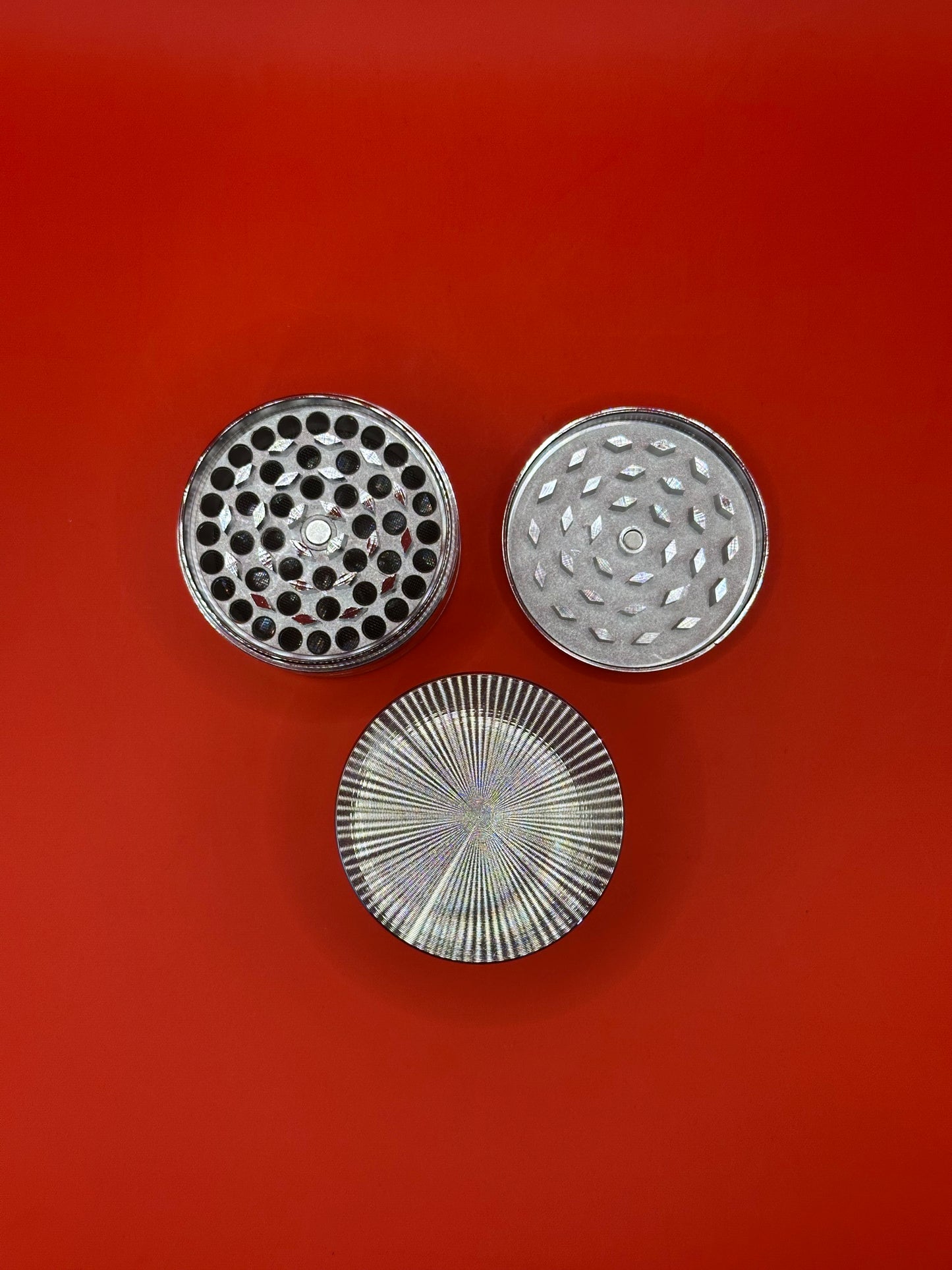 55mm shiny Metal Grinder with kief collector and scoop.