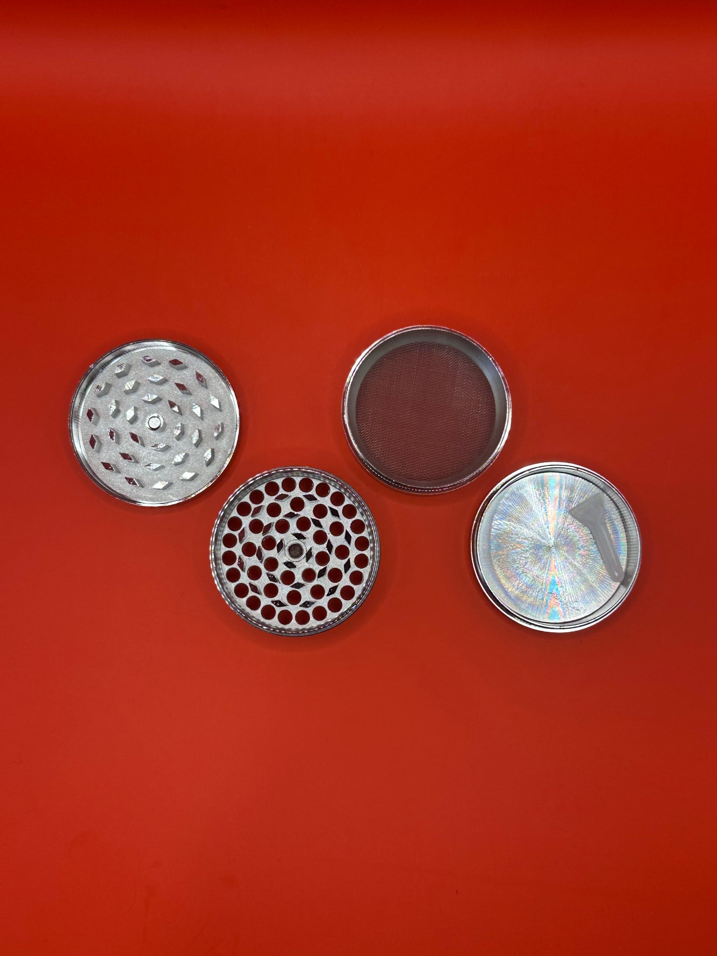 55mm shiny Metal Grinder with kief collector and scoop.