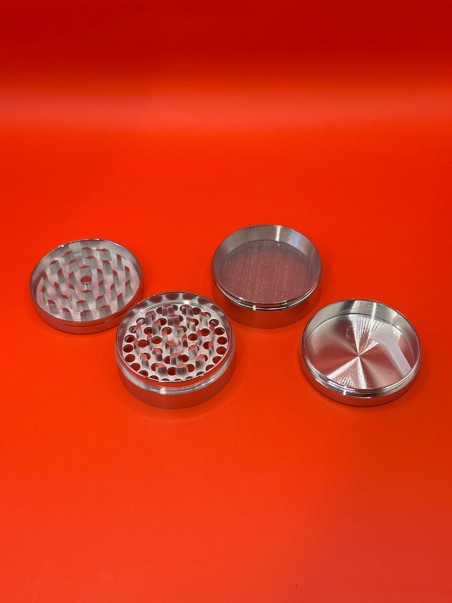 55mm shiny Metal Grinder with kief collector and scoop.