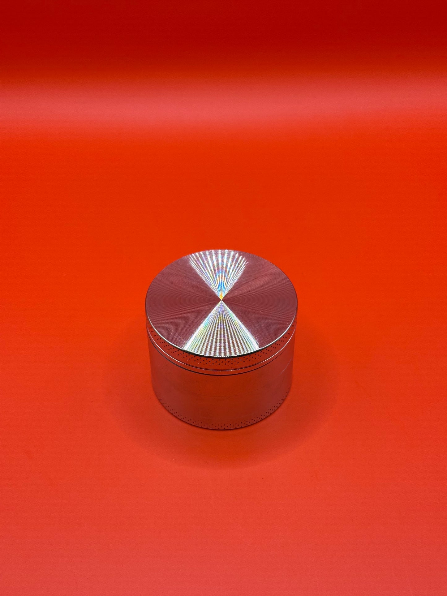 55mm shiny Metal Grinder with kief collector and scoop.