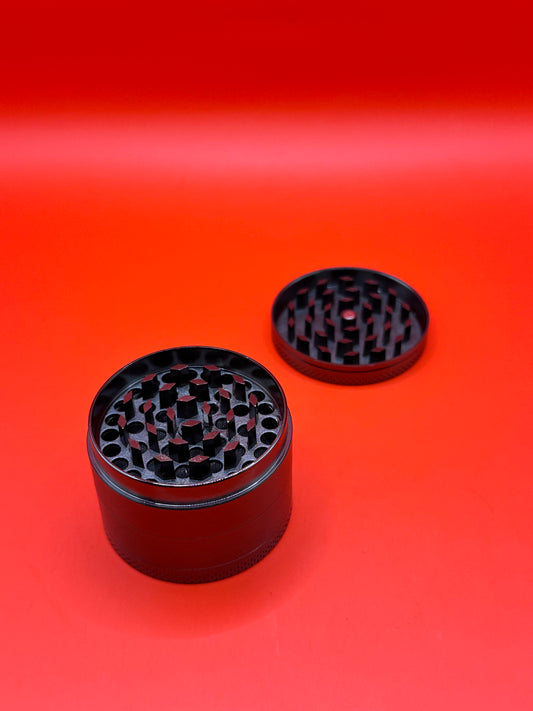 55mm shiny Metal Grinder with kief collector and scoop.