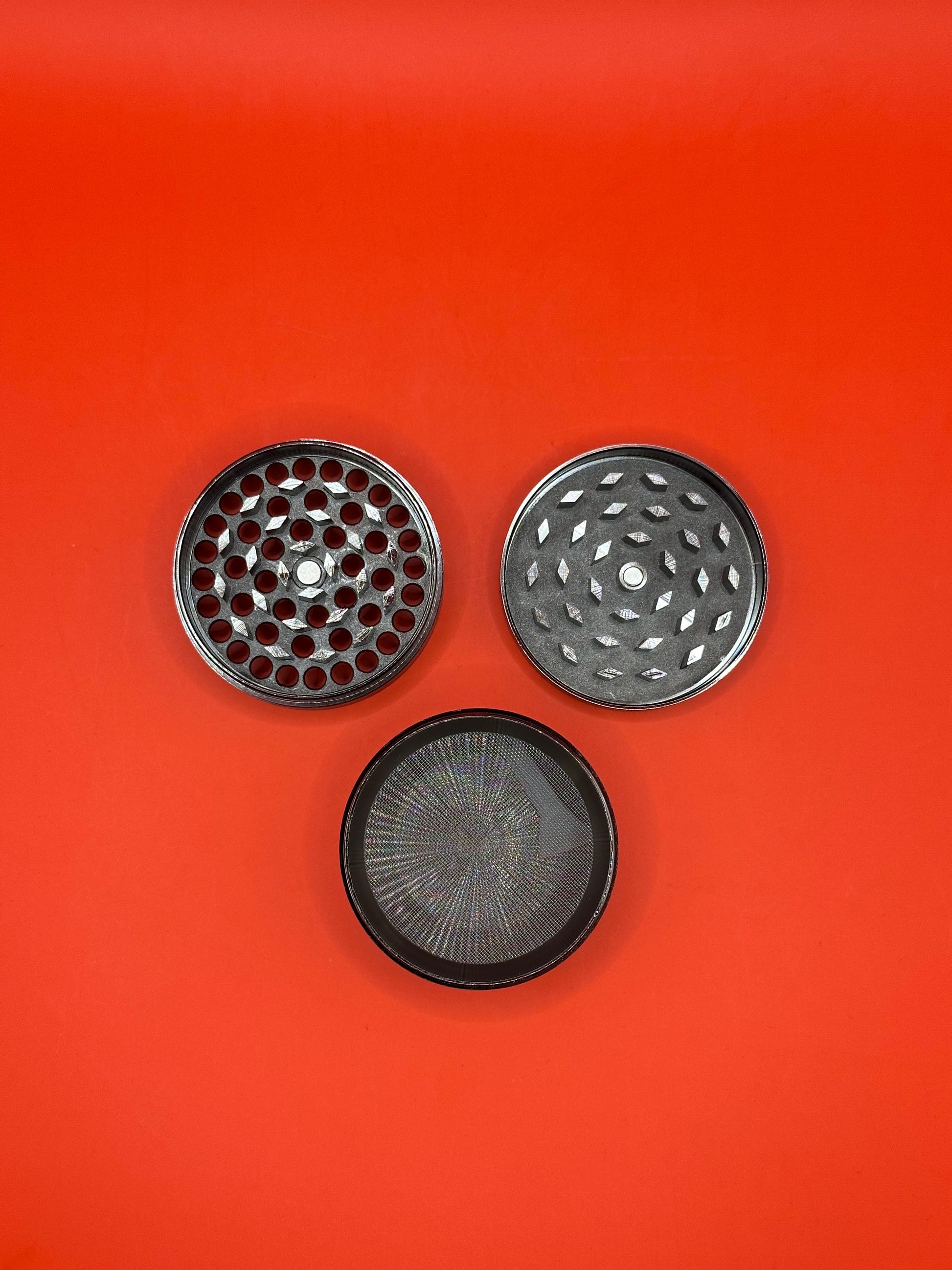 55mm shiny Metal Grinder with kief collector and scoop.