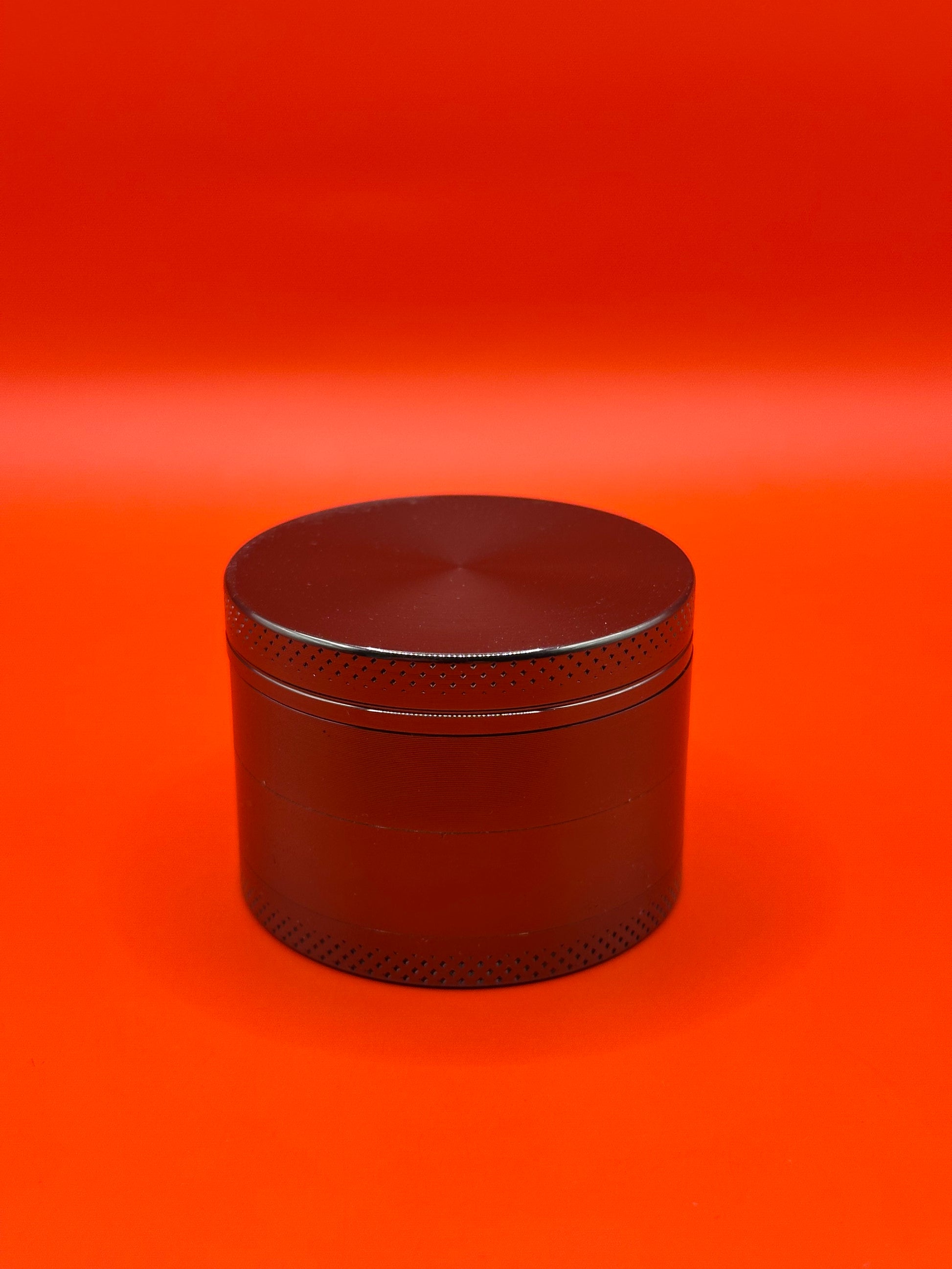 55mm shiny Metal Grinder with kief collector and scoop.