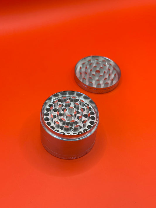 55mm shiny Metal Grinder with kief collector and scoop.